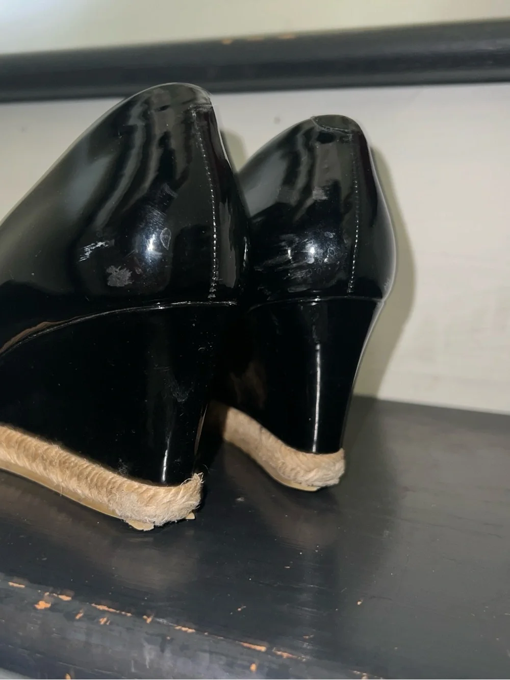 Black patent leather Gucci wedges with horsebit and peep toe